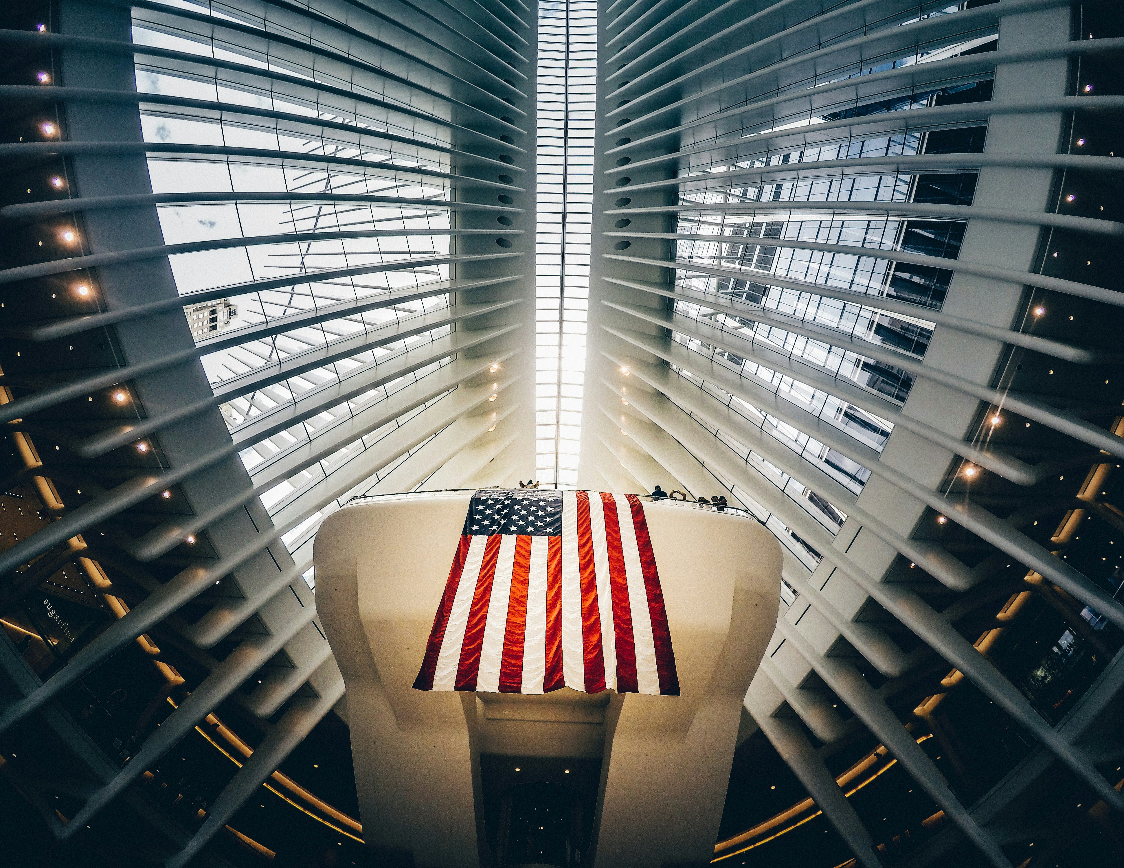 bottom photography of grey metal building and USA flag